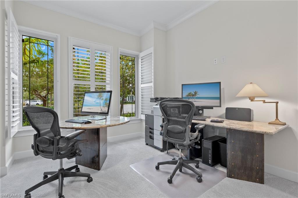 5797 Anegada Drive Naples, FL 34113 - Photo 11 of 40 a view of a workspace with furniture and a window