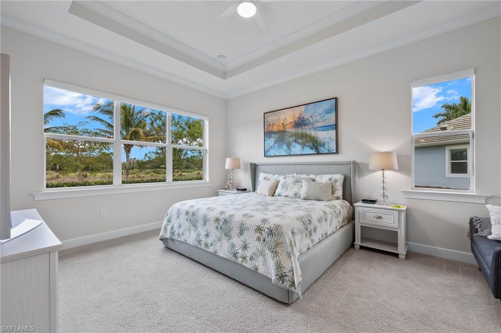 5797 Anegada Drive Naples, FL 34113 - Photo 15 of 40 a bedroom with a bed and a window