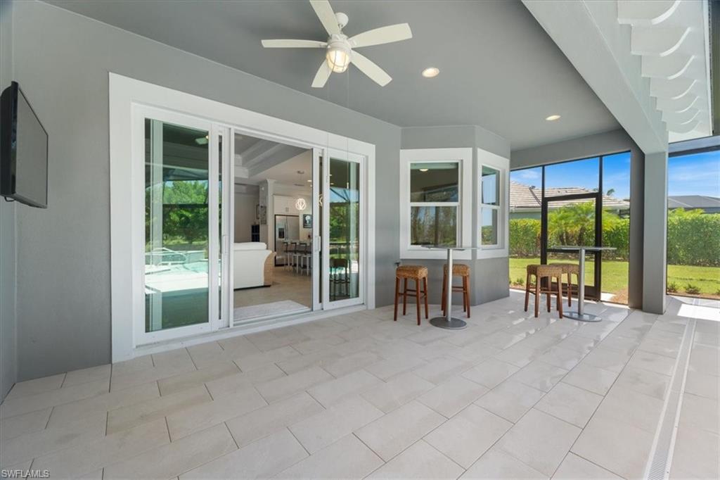 5797 Anegada Drive Naples, FL 34113 - Photo 27 of 40 a view of an entryway with floor to ceiling window