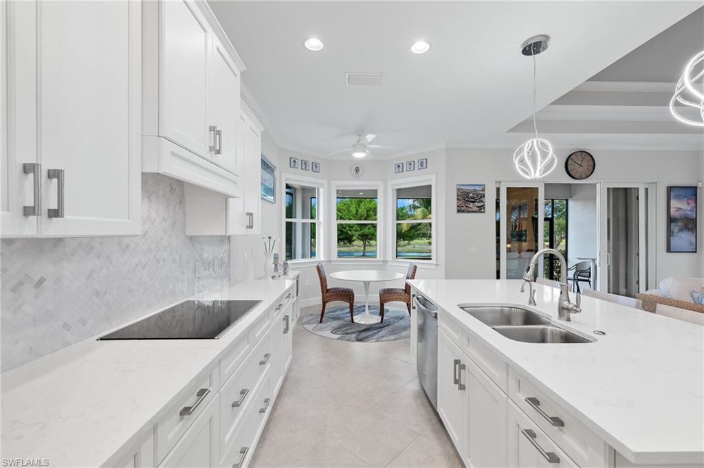 5797 Anegada Drive Naples, FL 34113 - Photo 8 of 40 a large white kitchen with a large window