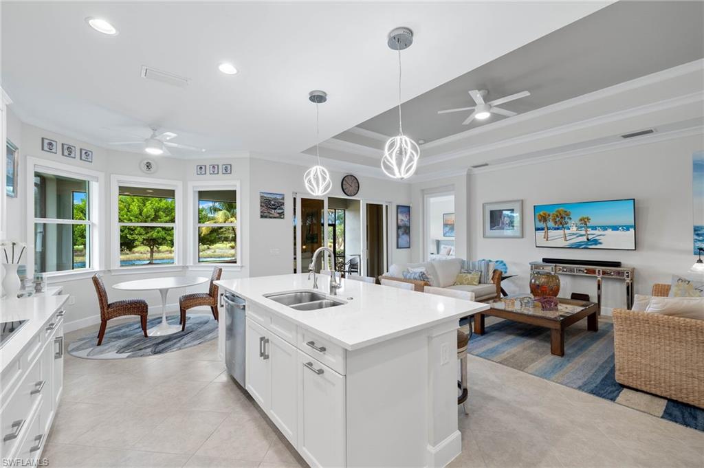 5797 Anegada Drive Naples, FL 34113 - Photo 9 of 40 a large white kitchen with a large window