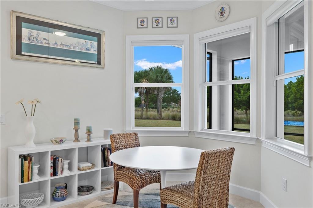 5797 Anegada Drive Naples, FL 34113 - Photo 10 of 40 a dining room with furniture and window
