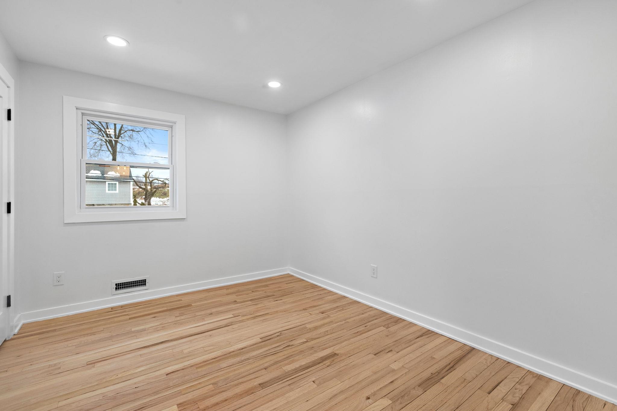 125 Rutgers Place Clifton, NJ 07013 - Photo 23 of 36 a view of room with wooden floor and window