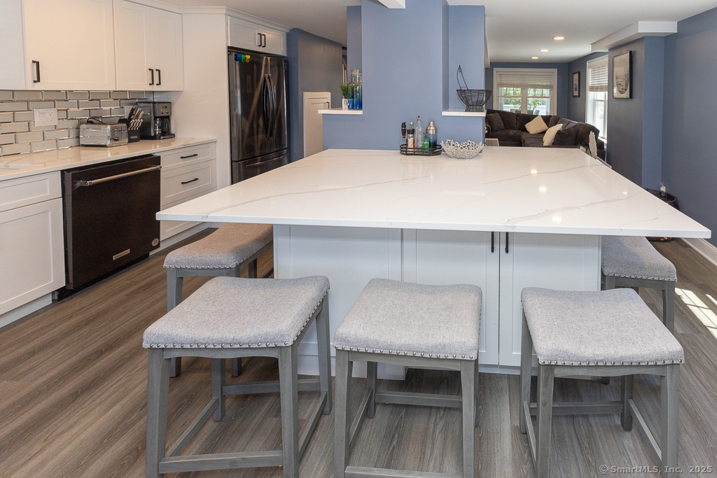 55 Swan Avenue Old Lyme, CT 06371 - Photo 16 of 40 a large white kitchen with a table and chairs