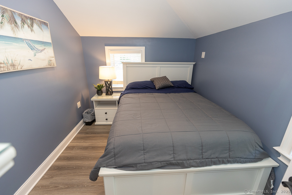 55 Swan Avenue Old Lyme, CT 06371 - Photo 20 of 40 a bedroom with a bed and window