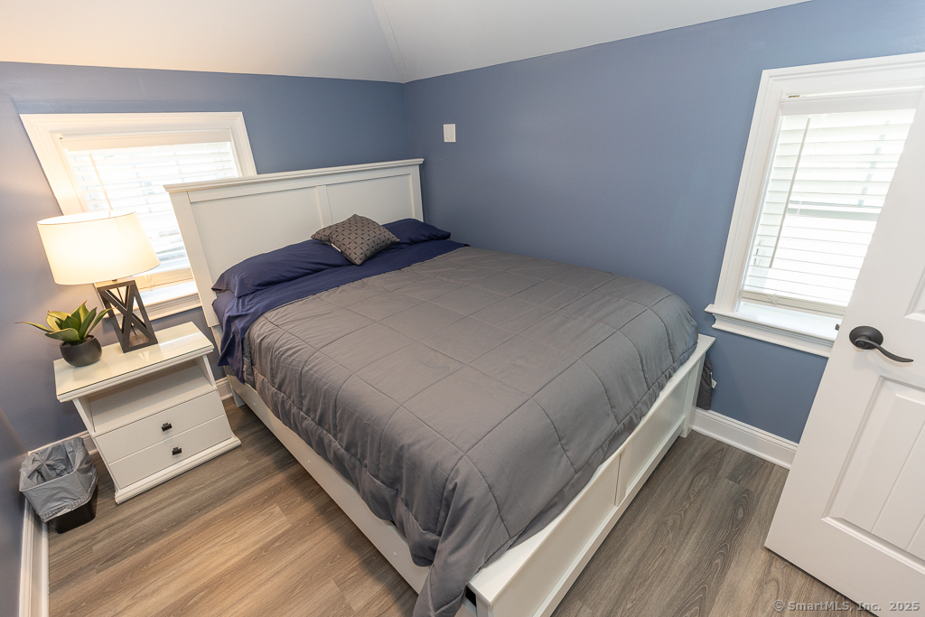 55 Swan Avenue Old Lyme, CT 06371 - Photo 21 of 40 a bed sitting in a bedroom next to a window