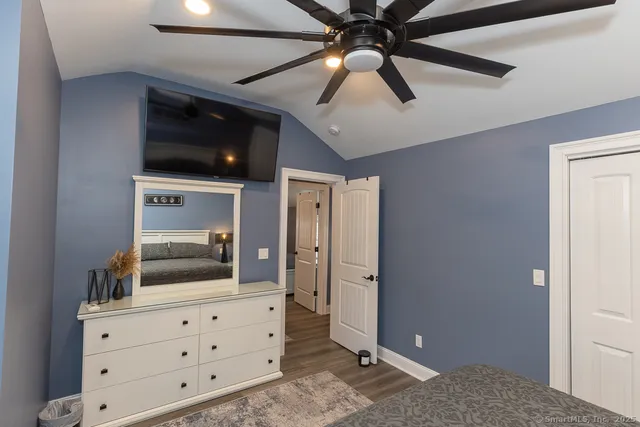 a bedroom with a bed and a dresser