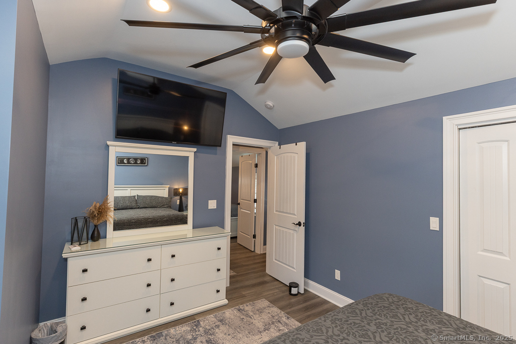 55 Swan Avenue Old Lyme, CT 06371 - Photo 22 of 40 a bedroom with a bed and a dresser