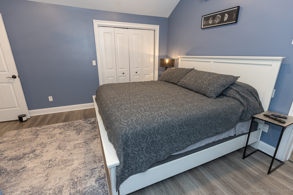 55 Swan Avenue Old Lyme, CT 06371 - Photo 26 of 40 a bed sitting in a bedroom next to a window