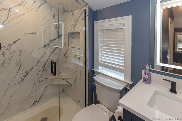 a bathroom with a sink and toilet