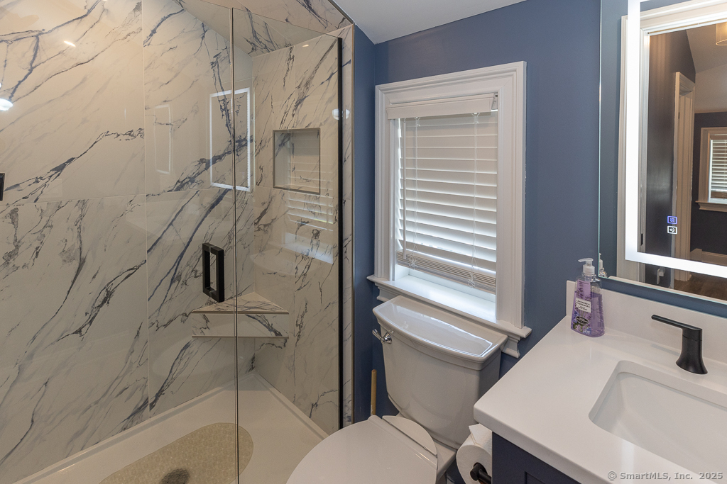 55 Swan Avenue Old Lyme, CT 06371 - Photo 32 of 40 a bathroom with a sink and toilet