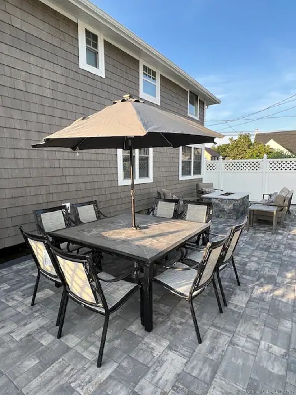 55 Swan Avenue Old Lyme, CT 06371 - Photo 35 of 40 a backyard of a house with table and chairs