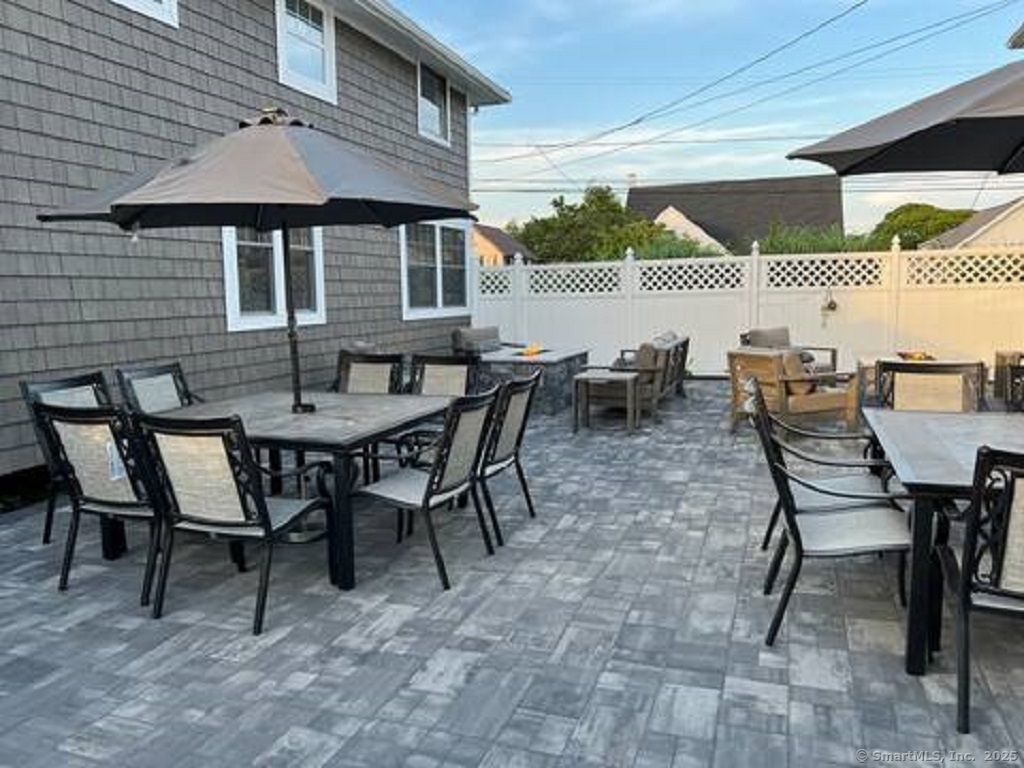 55 Swan Avenue Old Lyme, CT 06371 - Photo 36 of 40 a dining area with a table and chairs