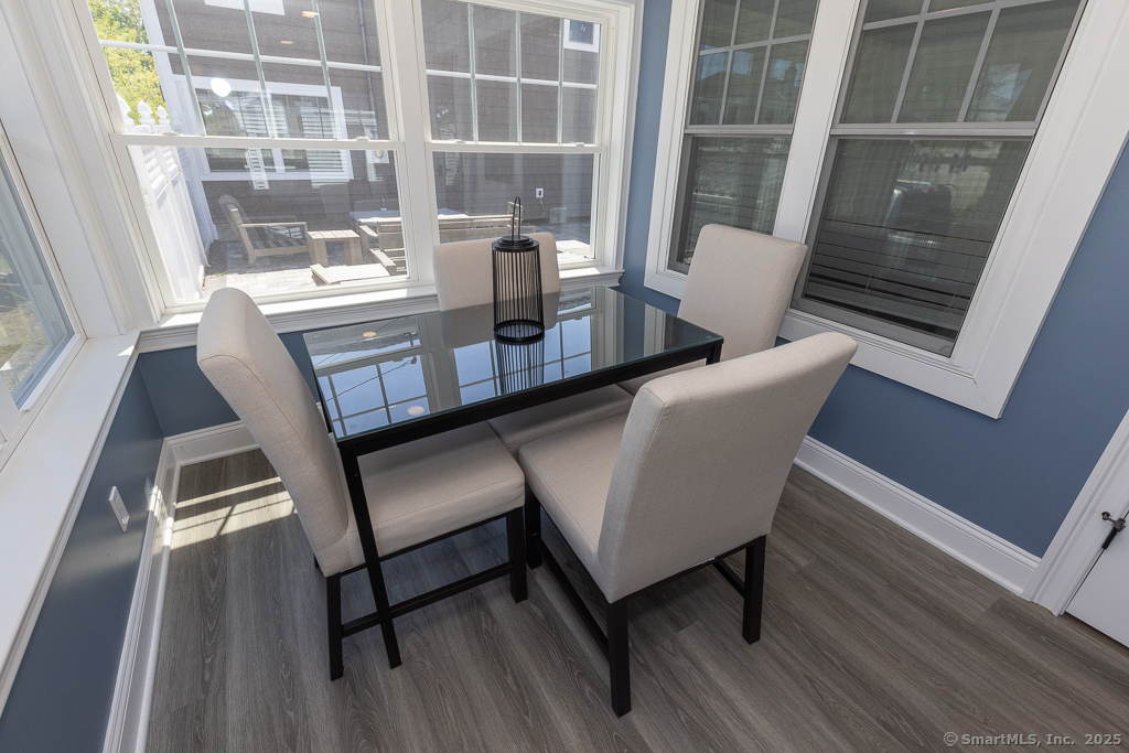 55 Swan Avenue Old Lyme, CT 06371 - Photo 4 of 40 a view of a dining room with furniture window and wooden floor