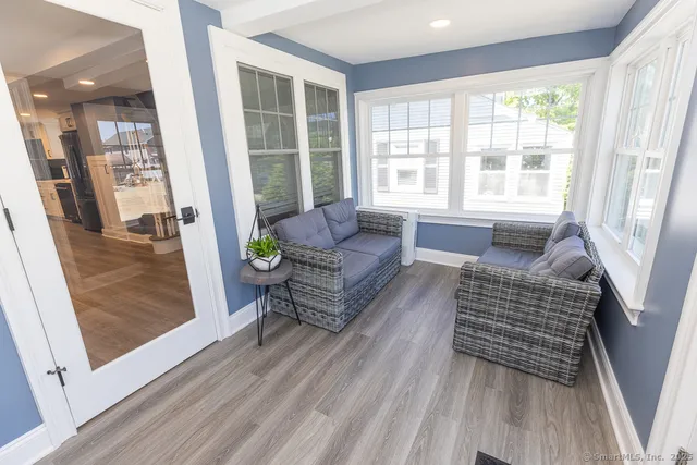 a living room with furniture and a rug