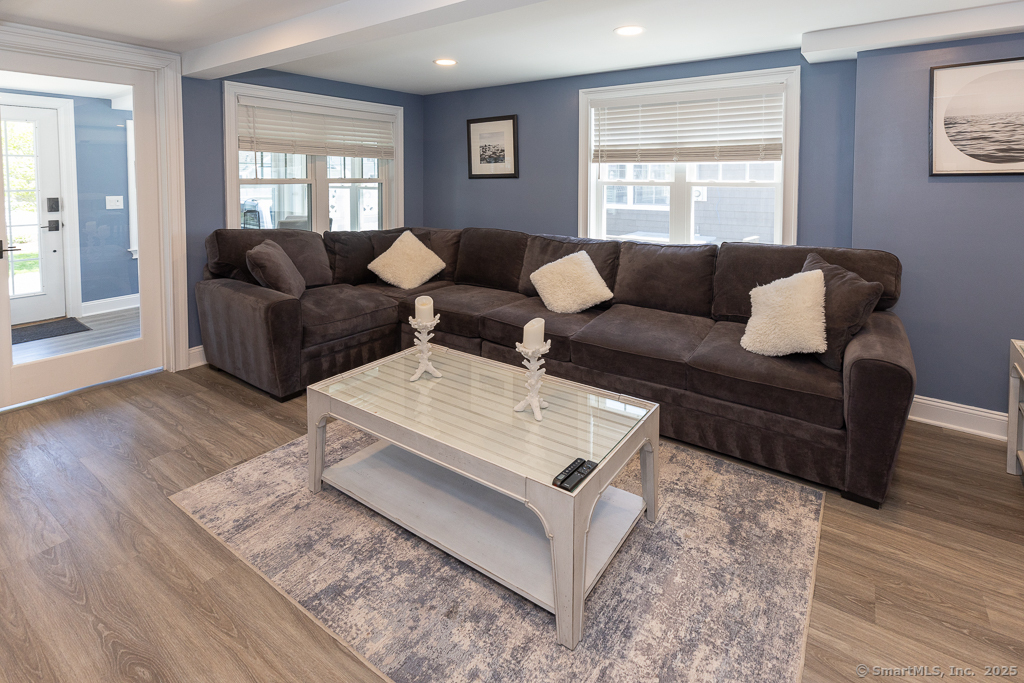 55 Swan Avenue Old Lyme, CT 06371 - Photo 9 of 40 a living room with furniture and wooden floor