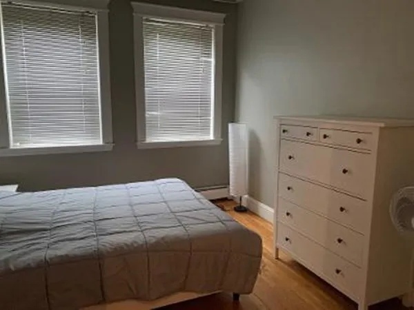 a bathroom with a sink a mirror toilet and bathtub