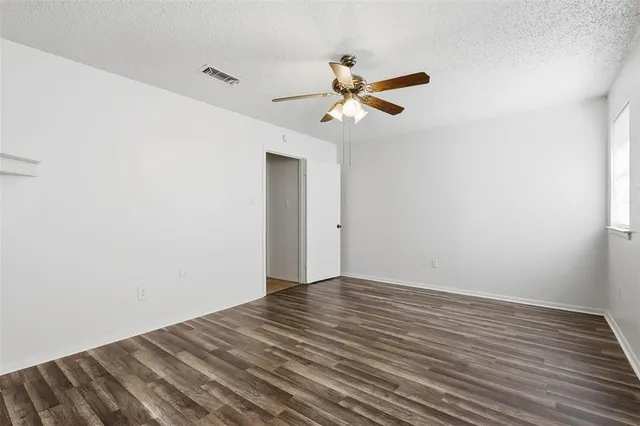 a view of room with wooden floor