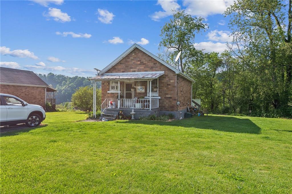 375 Reduction Road Smithton, PA 15479 - Photo 17 of 30 a view of a house with a yard