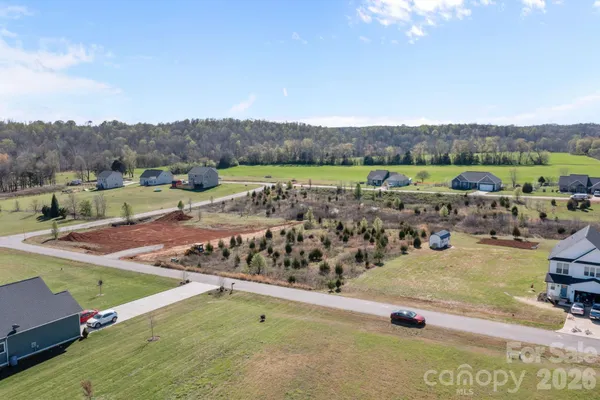 a view of a swimming pool and a yard