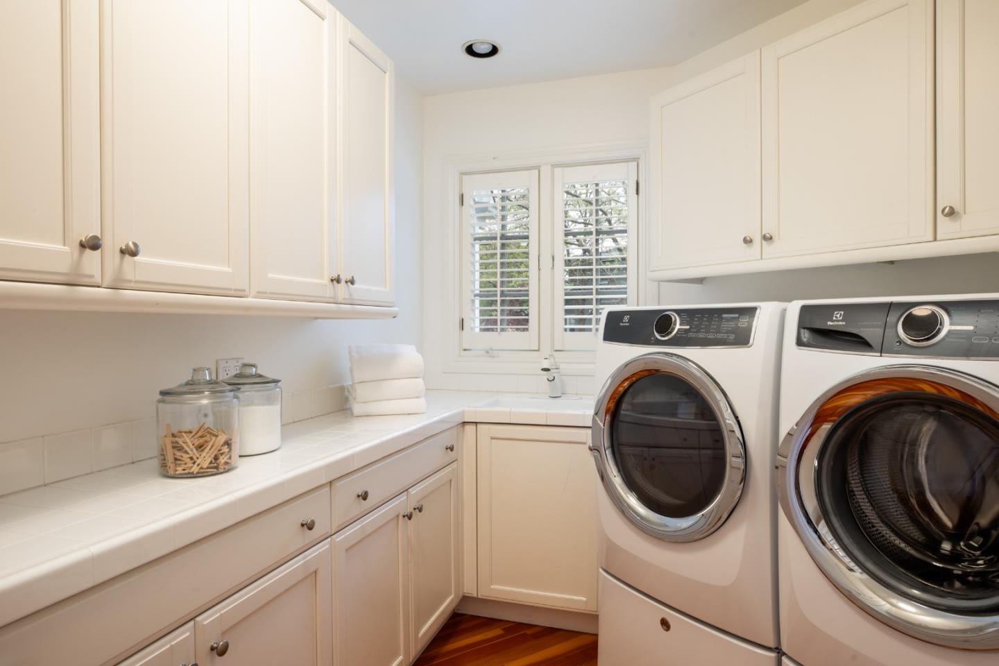 166 Seminary Drive Menlo Park, CA 94025 - Photo 21 of 41 a utility room with sink dryer and washer