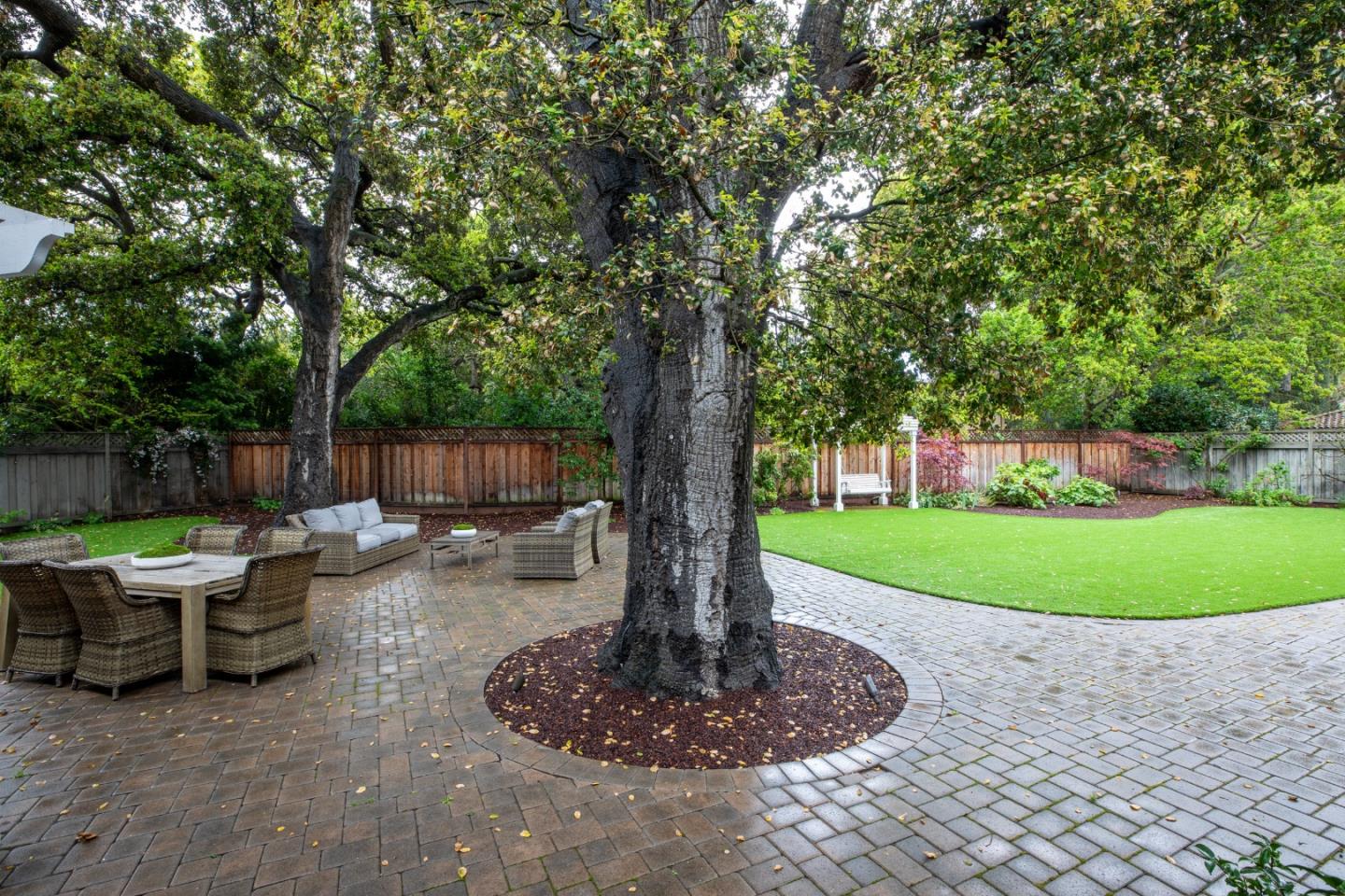 166 Seminary Drive Menlo Park, CA 94025 - Photo 28 of 41 a backyard of a house with fountain table and chairs