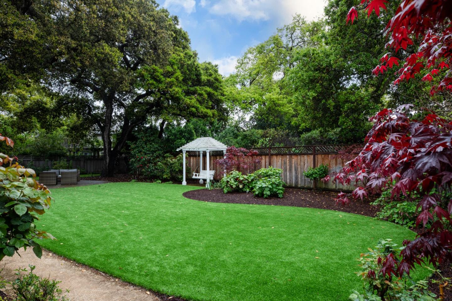166 Seminary Drive Menlo Park, CA 94025 - Photo 33 of 41 a view of a garden with a fountain