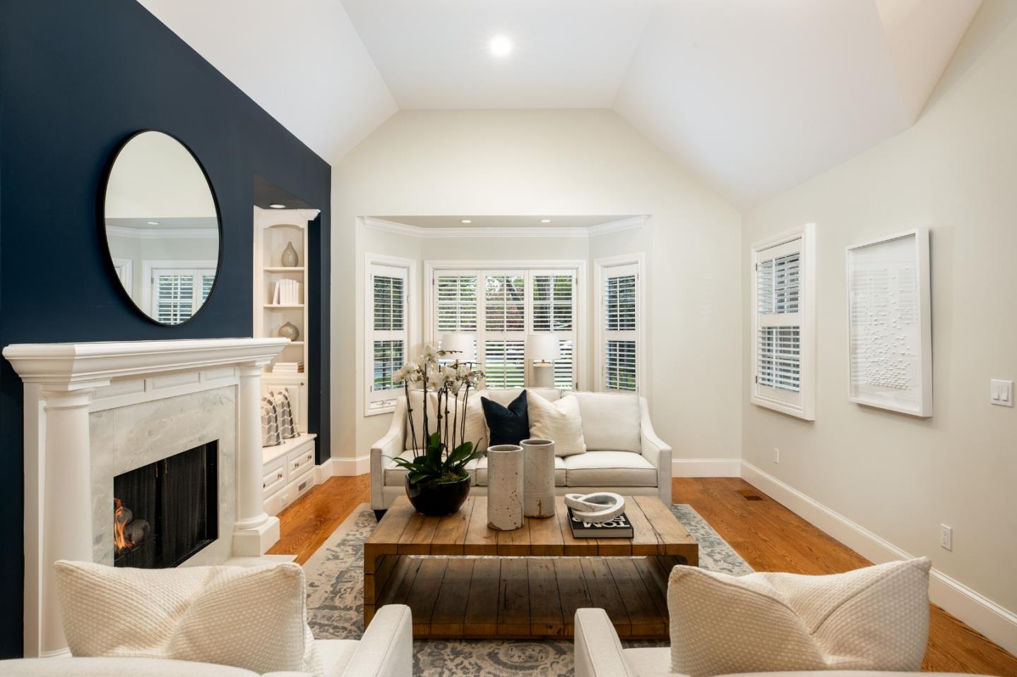 166 Seminary Drive Menlo Park, CA 94025 - Photo 8 of 41 a living room with furniture a fireplace and a large window