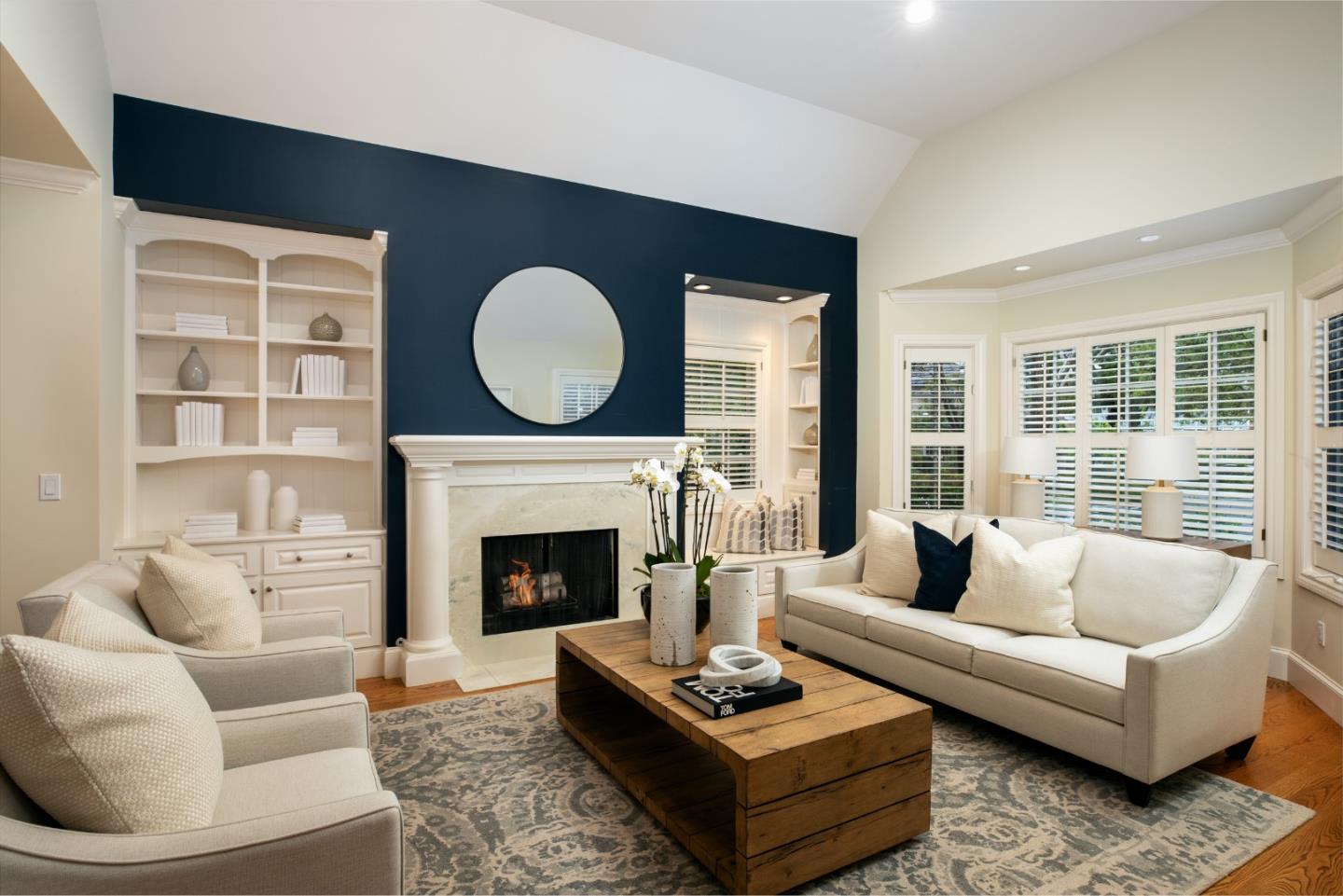 166 Seminary Drive Menlo Park, CA 94025 - Photo 9 of 41 a living room with furniture a rug a fireplace and a large window