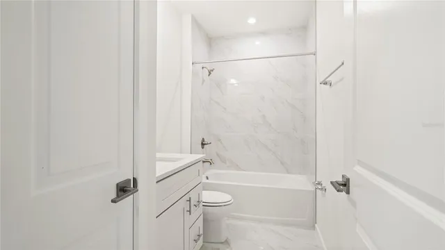 a bathroom with a shower a bathtub and a shower