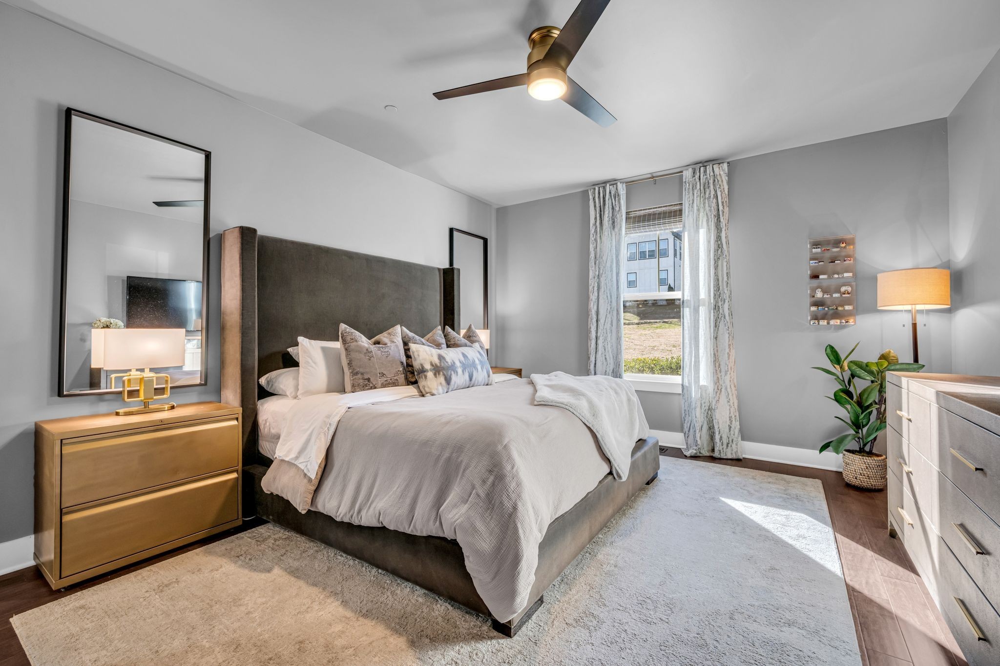 111 Ellersly Way Kingston Springs, TN 37082 - Photo 20 of 46 a spacious bedroom with a bed and a chandelier