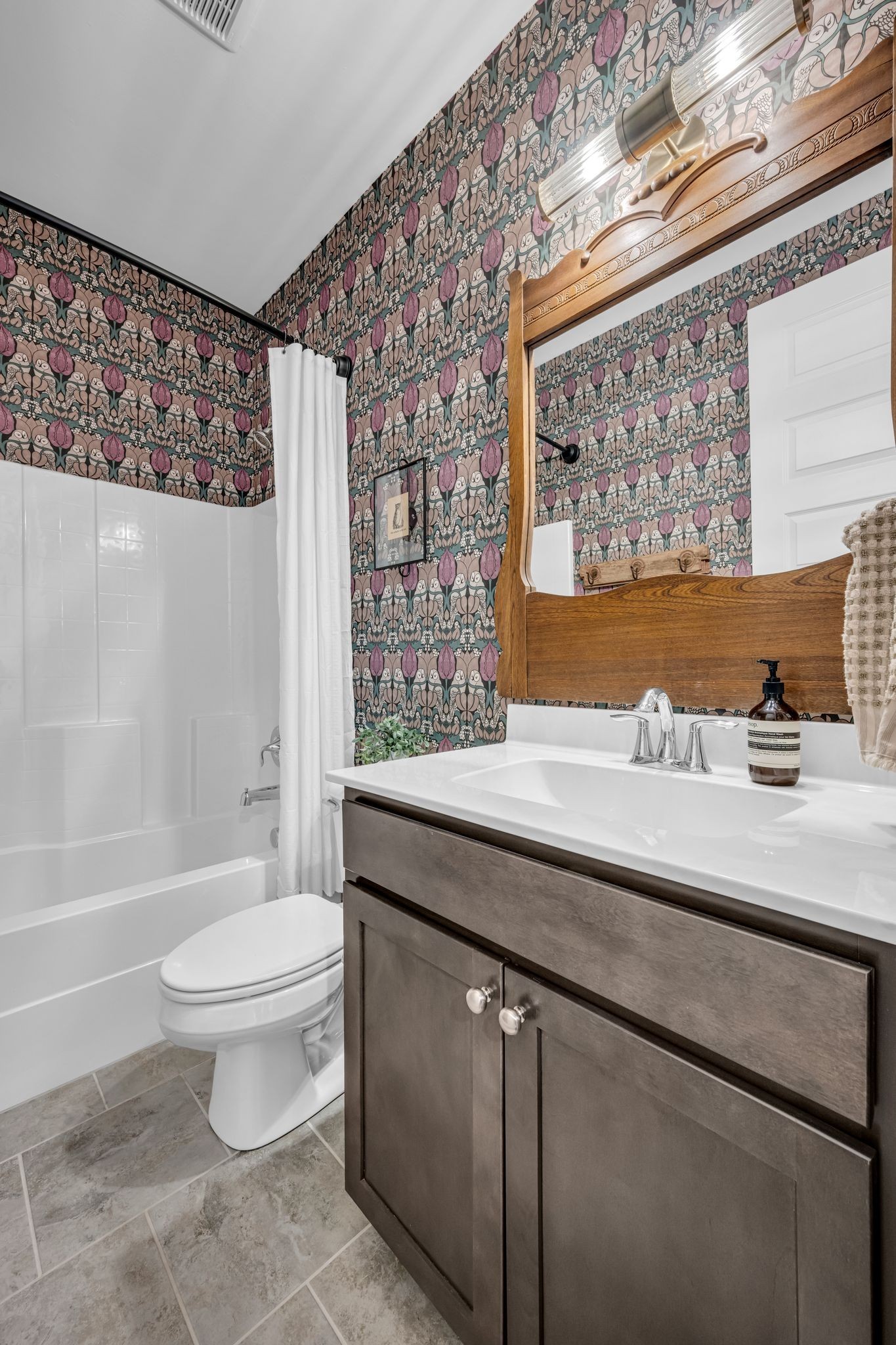 111 Ellersly Way Kingston Springs, TN 37082 - Photo 8 of 46 a bathroom with a granite countertop sink a toilet a mirror and shower