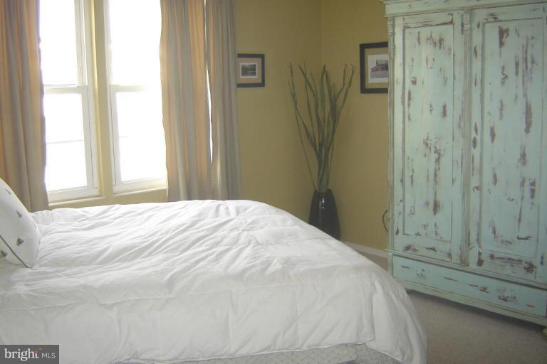 17563 Kohlhoss Road Poolesville, MD 20837 - Photo 10 of 20 a bedroom with a bed and a window