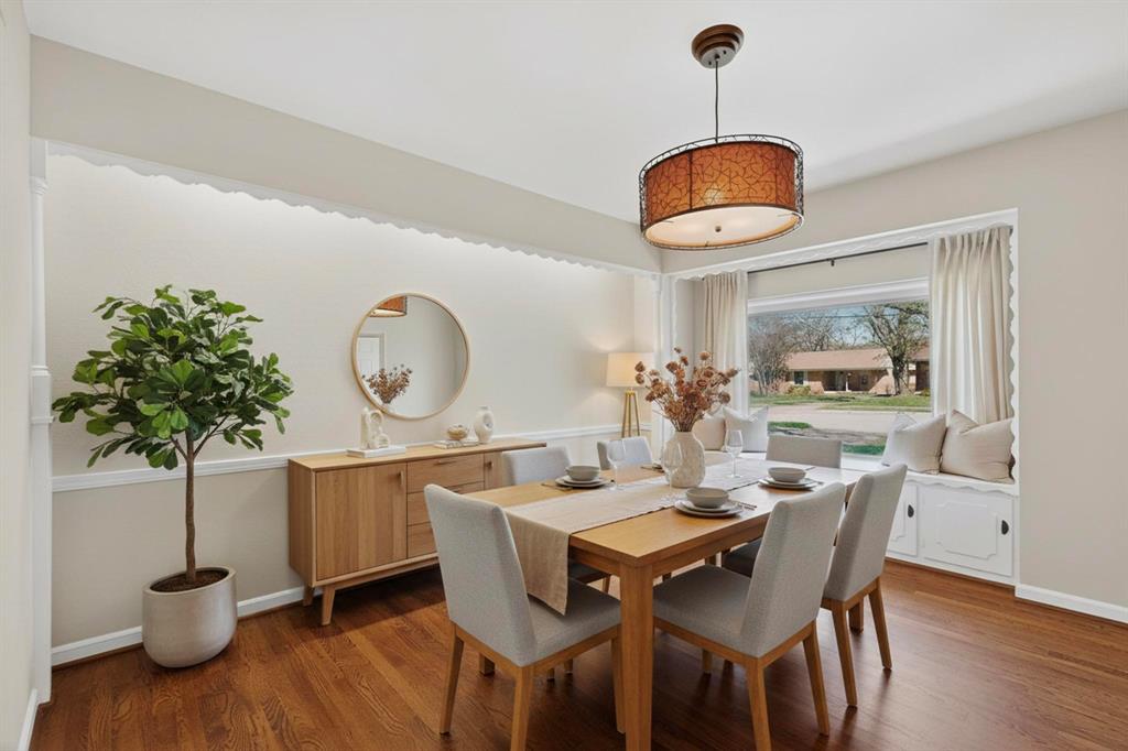 2120 Healey Drive Dallas, TX 75228 - Photo 8 of 39 a dining room with furniture potted plants and wooden floor