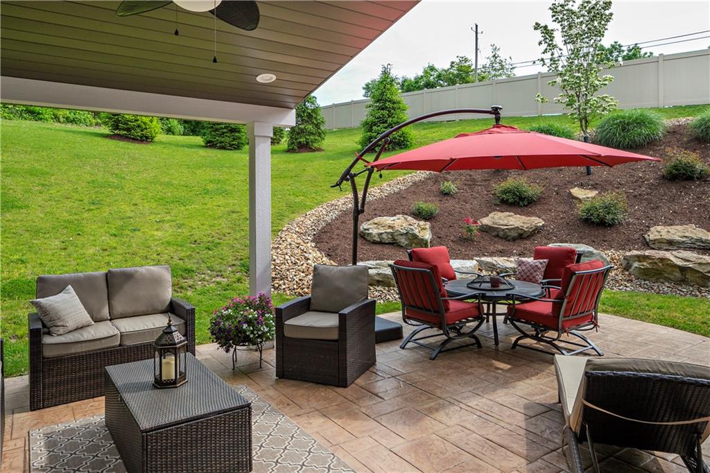 100 Meadow Road Irwin, PA 15642 - Photo 14 of 25 The Perfect Place to Relax or Entertain - with Ceiling Fan and Custom Stamped Concrete Patio.