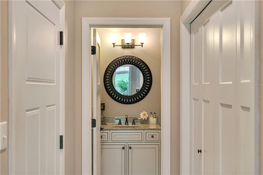 100 Meadow Road Irwin, PA 15642 - Photo 19 of 25 Main Floor Powder Room with Upgraded Vanity & 3pc Fixtures. Laundry Closet to Right, Garage access to Left.