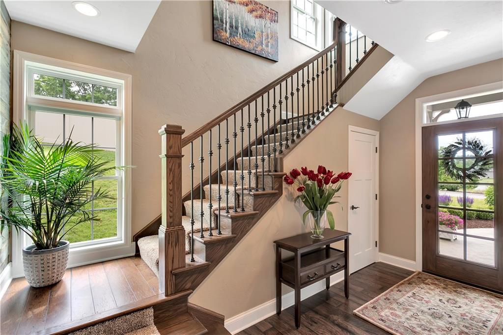 100 Meadow Road Irwin, PA 15642 - Photo 3 of 25 Light & Bright Entry with Transom Windows, Engineered Wood Floors, and Gorgeous Iron/Wood Railing.