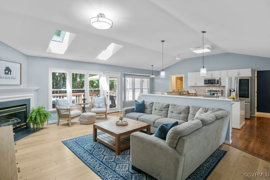 15300 Houndmaster Circle Midlothian, VA 23112 - Photo 11 of 48 a living room with furniture ceiling fan and a fireplace