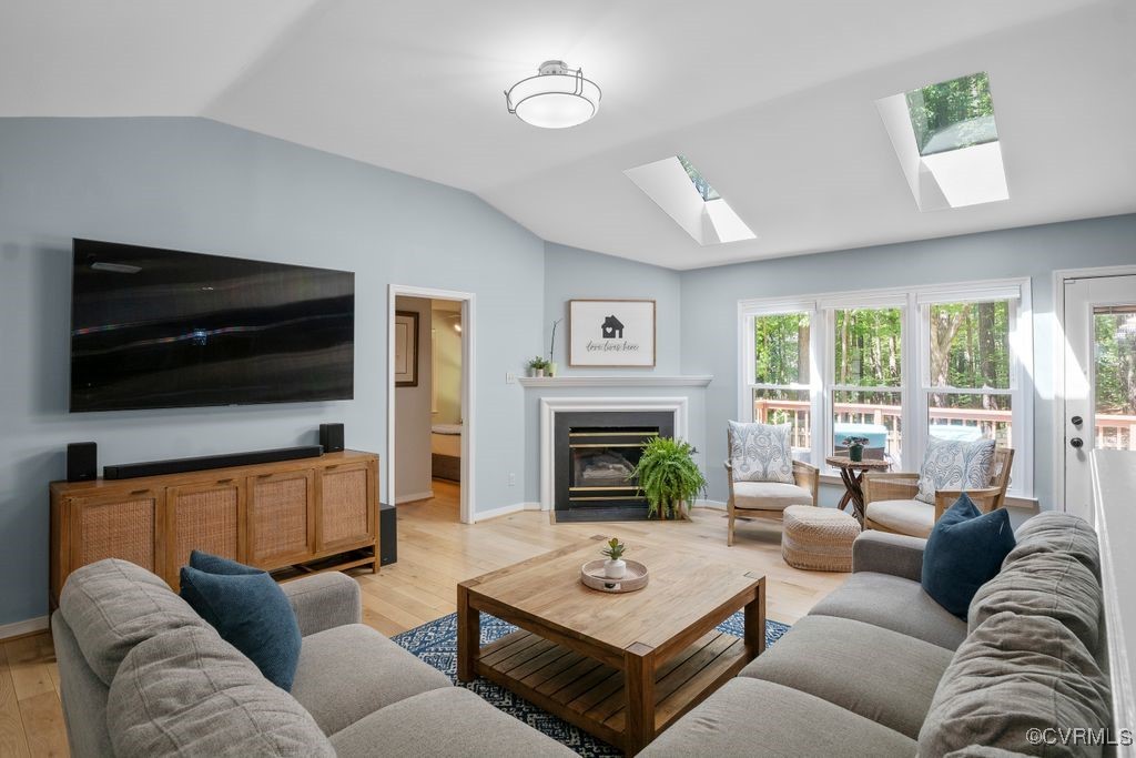 15300 Houndmaster Circle Midlothian, VA 23112 - Photo 12 of 48 a living room with furniture a flat screen tv and a large window