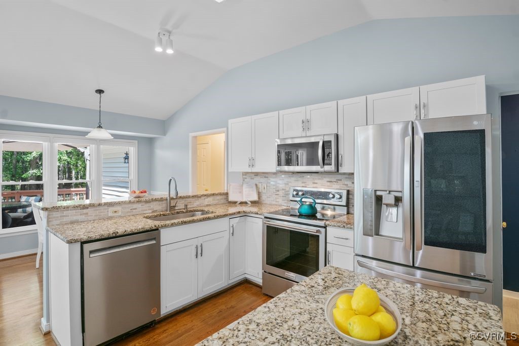 15300 Houndmaster Circle Midlothian, VA 23112 - Photo 16 of 48 a kitchen with stainless steel appliances granite countertop a sink stove and refrigerator