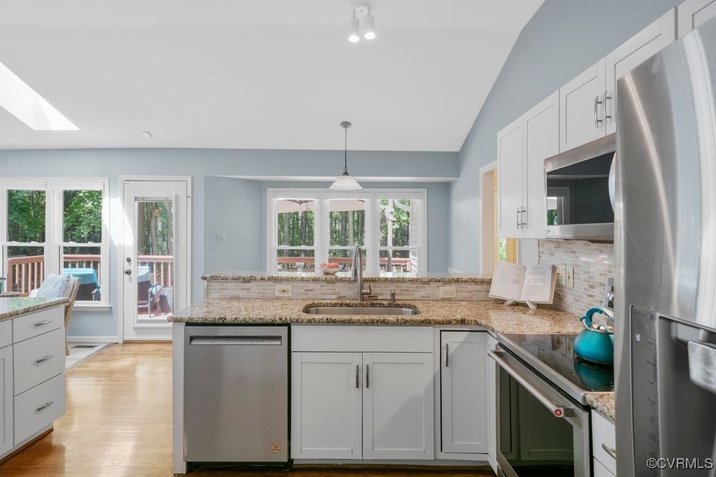 15300 Houndmaster Circle Midlothian, VA 23112 - Photo 17 of 48 a kitchen with granite countertop a sink and a stove top oven
