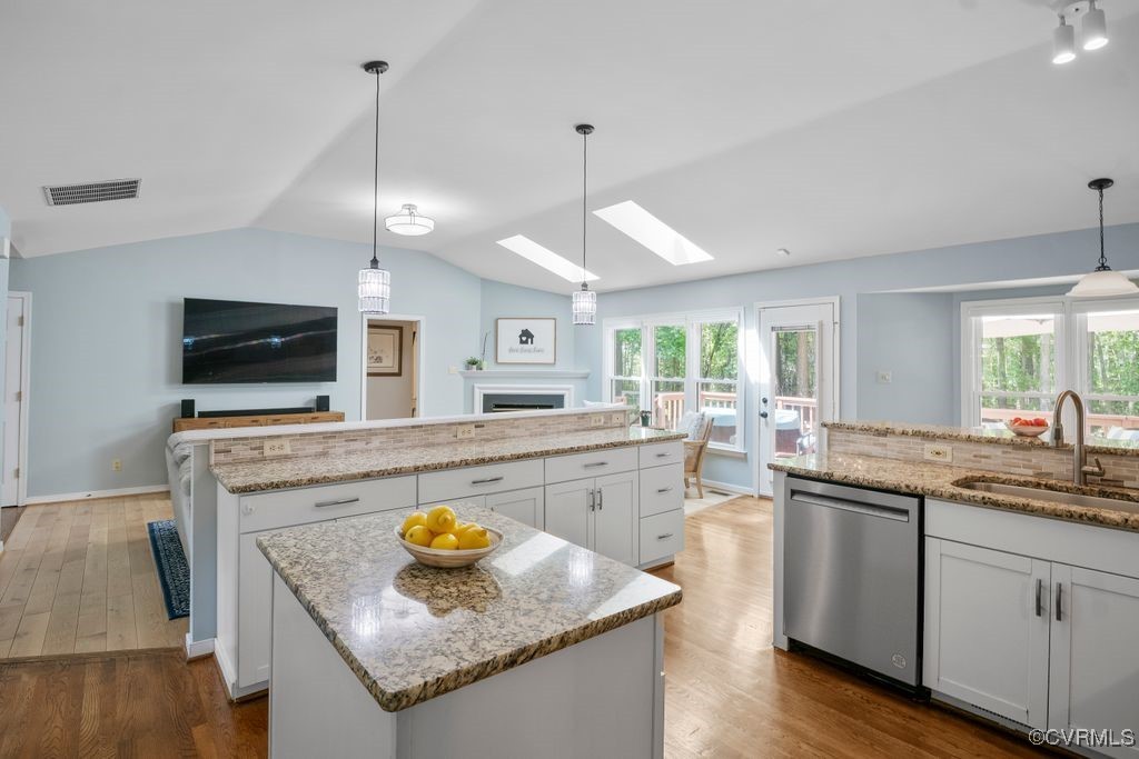 15300 Houndmaster Circle Midlothian, VA 23112 - Photo 19 of 48 a kitchen with stainless steel appliances granite countertop a sink a stove and a wooden floors