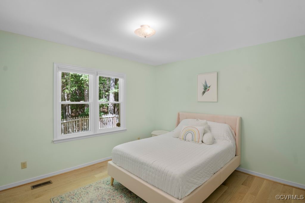 15300 Houndmaster Circle Midlothian, VA 23112 - Photo 24 of 48 a bedroom with a bed and a window