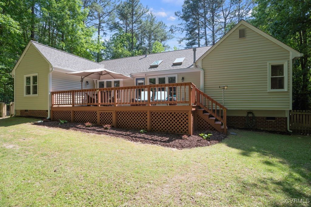 15300 Houndmaster Circle Midlothian, VA 23112 - Photo 38 of 48 a view of a house with a yard and a wooden deck