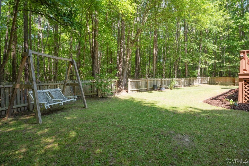 15300 Houndmaster Circle Midlothian, VA 23112 - Photo 40 of 48 a view of a park with swings and a slide