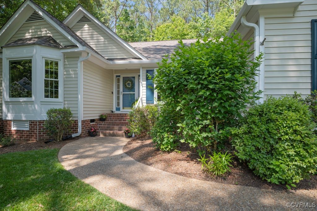15300 Houndmaster Circle Midlothian, VA 23112 - Photo 5 of 48 a view of a house with a yard and potted plants