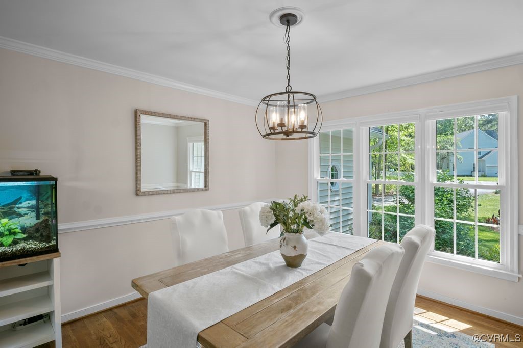 15300 Houndmaster Circle Midlothian, VA 23112 - Photo 9 of 48 a view of a dining room with furniture wooden floor and chandelier