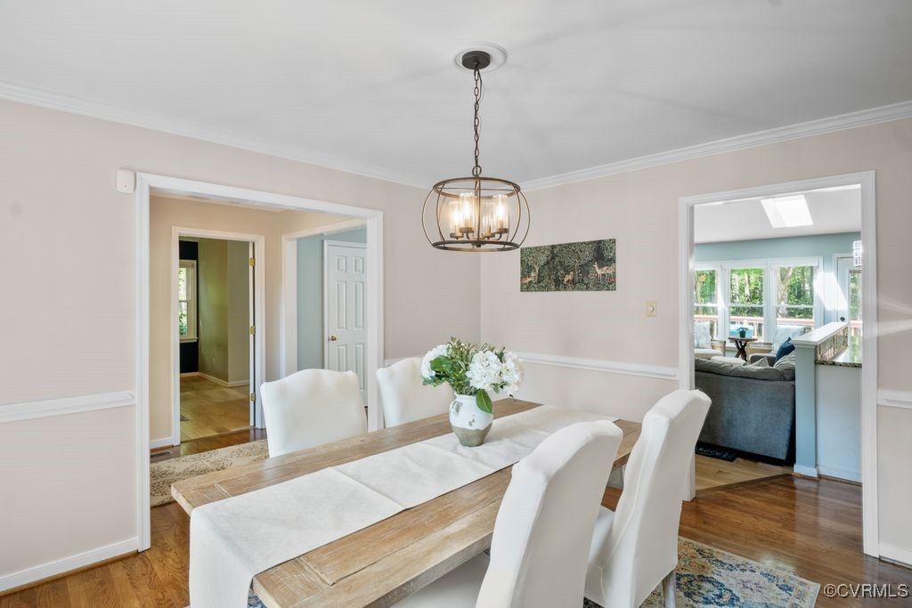15300 Houndmaster Circle Midlothian, VA 23112 - Photo 10 of 48 a view of a dining room with furniture wooden floor and chandelier