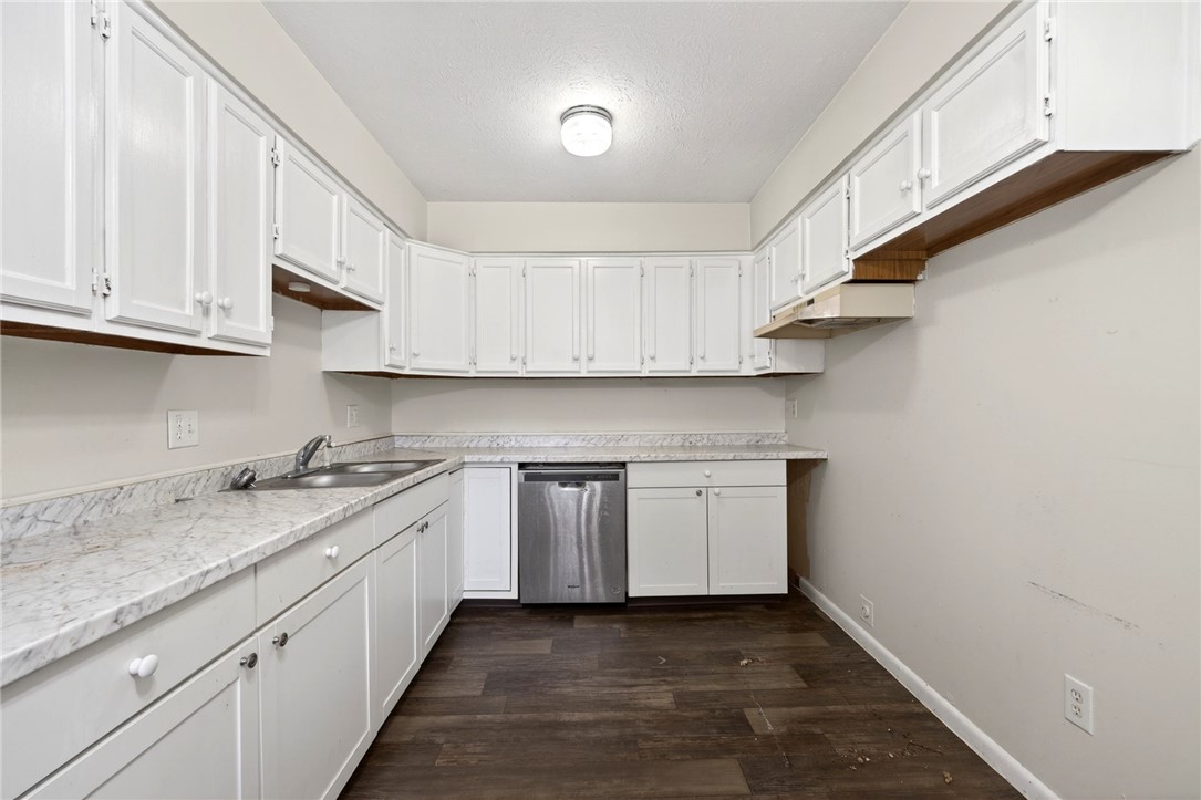 3659 Trail-On Road Dayton, OH 45439 - Photo 13 of 38 This galley kitchen features ample cabinetry and a functional layout, ready for your culinary adventures.