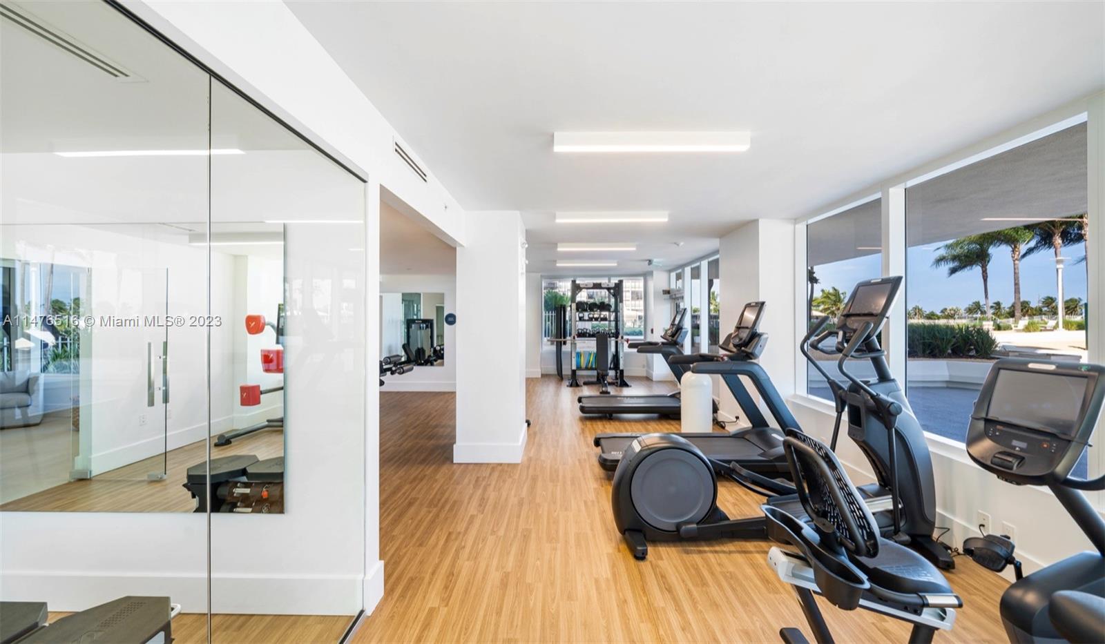 555 Northeast 34th Street, Unit PH5 Miami, FL 33137 - Photo 26 of 29 a view of a room with gym equipment